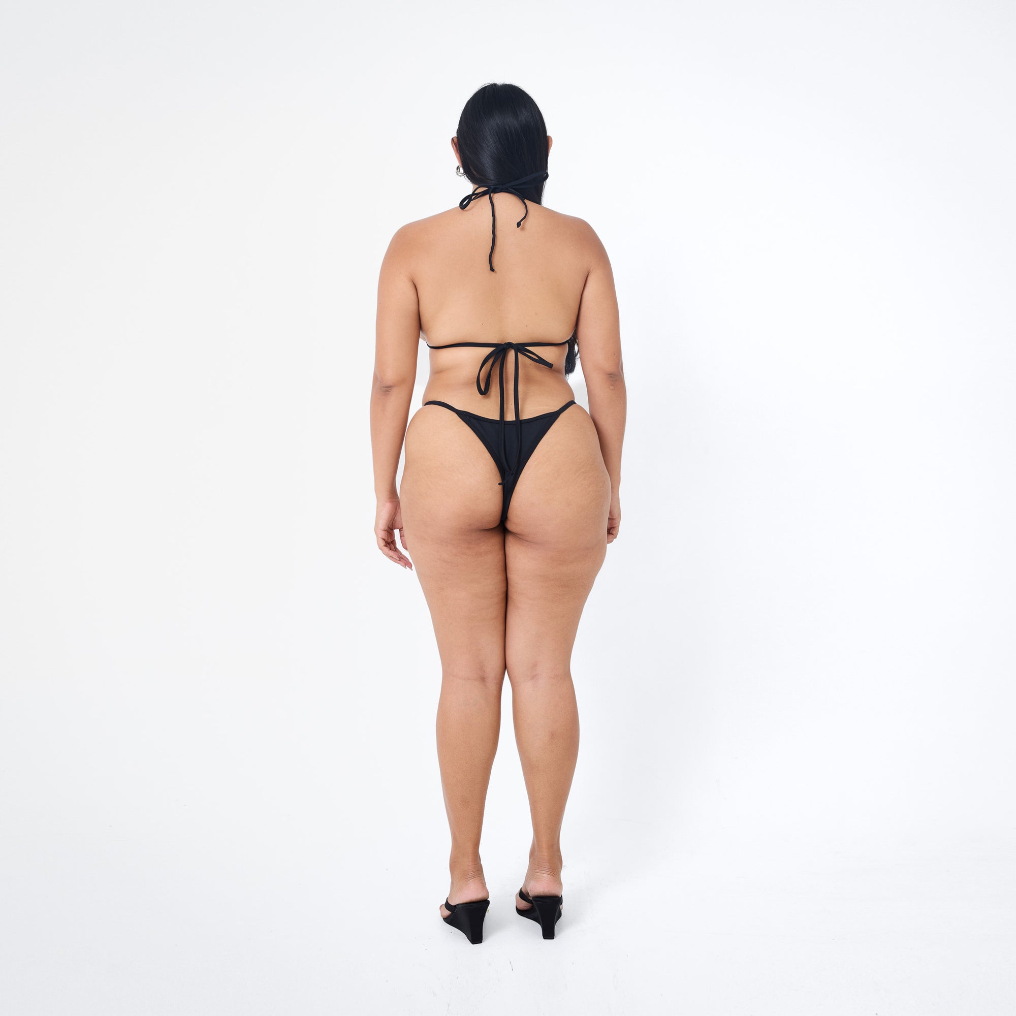 Arthur Apparel strappy bikini bottom in black with silver heart charm