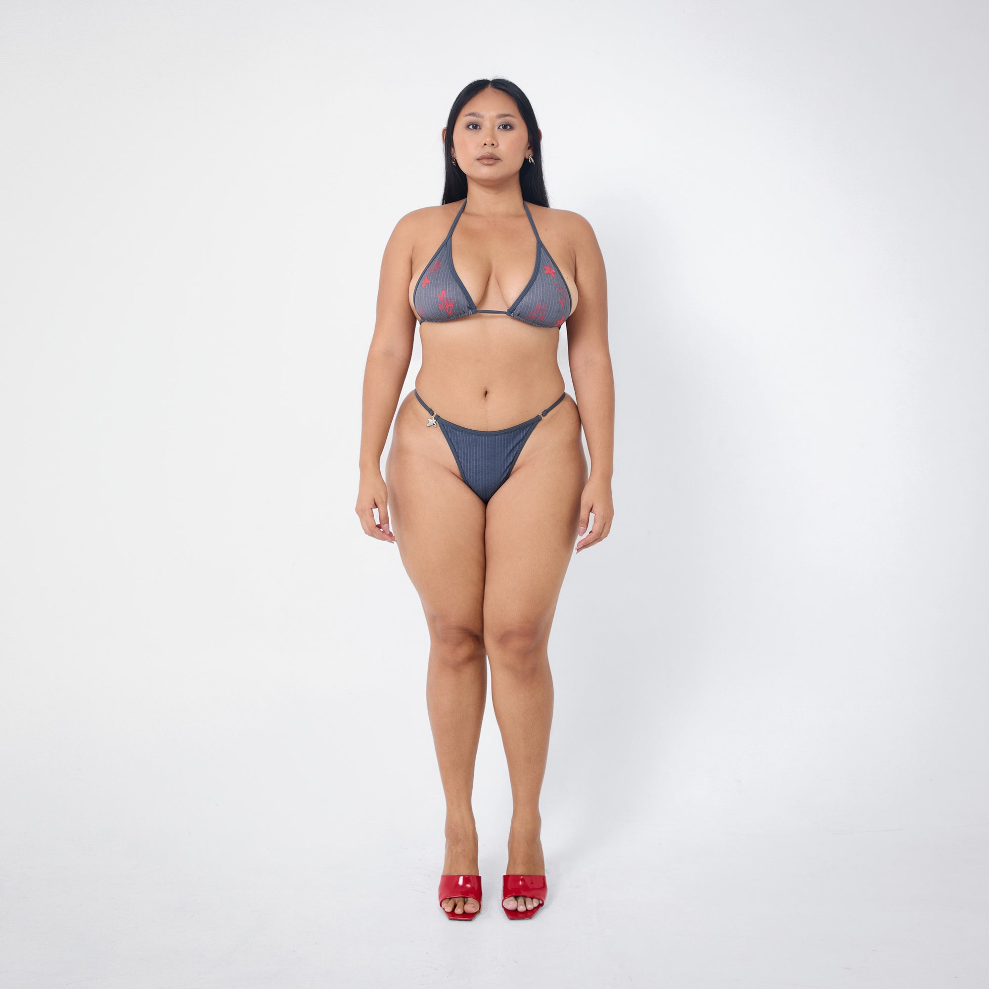 Arthur Apparel strappy bikini bottom in grey and red pinstripe print with silver butterfly charm