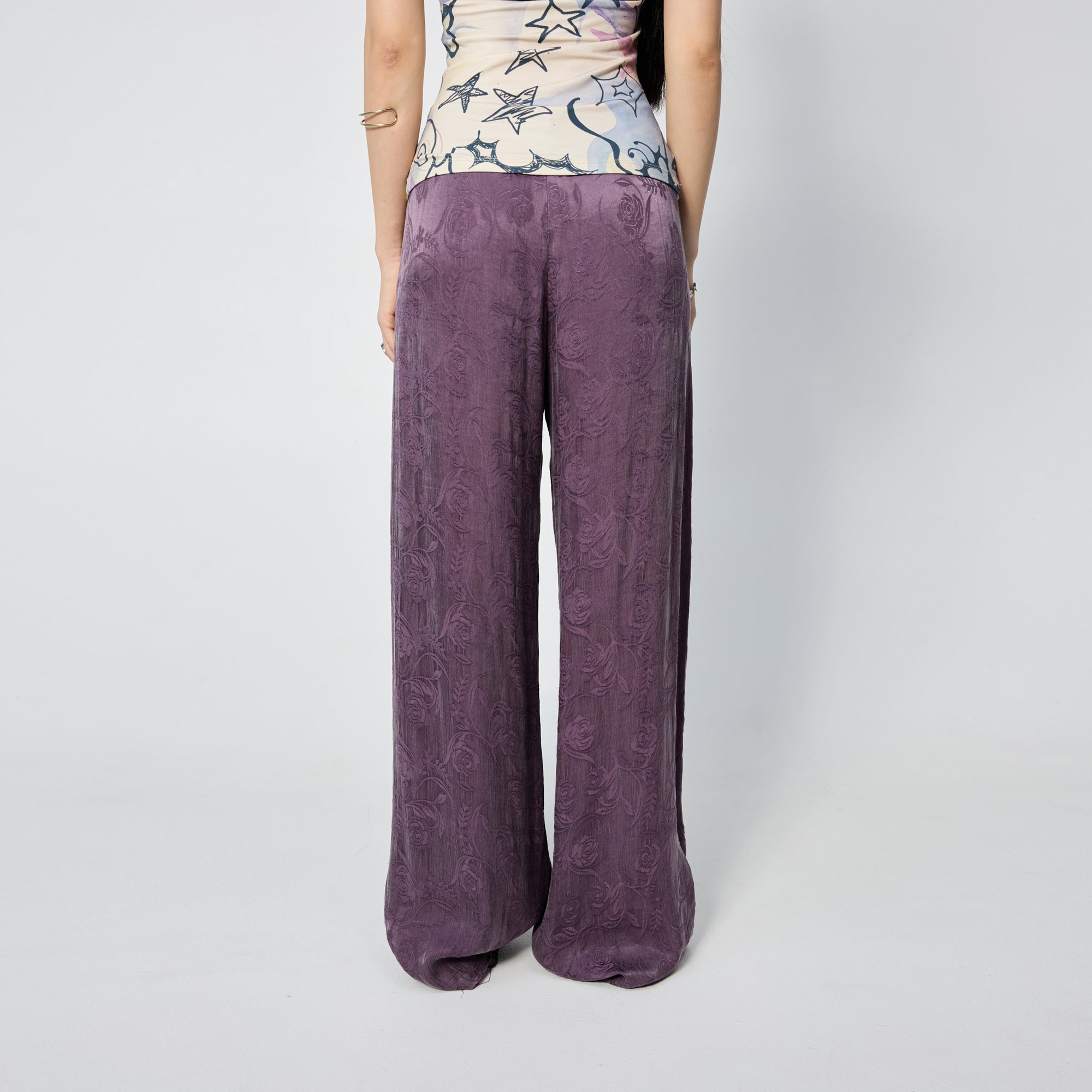 Arthur Apparel purple straight leg pant with frayed hem and roses print